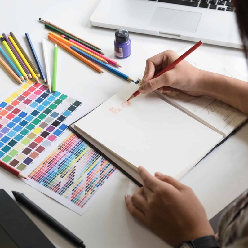 Artist creative graphic designer working on creative desk.